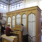 Duncan Mathews, Production Director, testing out the Hakadal Kirke organ overlooked by Andrew Scott, Head Voicer (left) and Jaraslav Strazovsky, Team Leader (right).